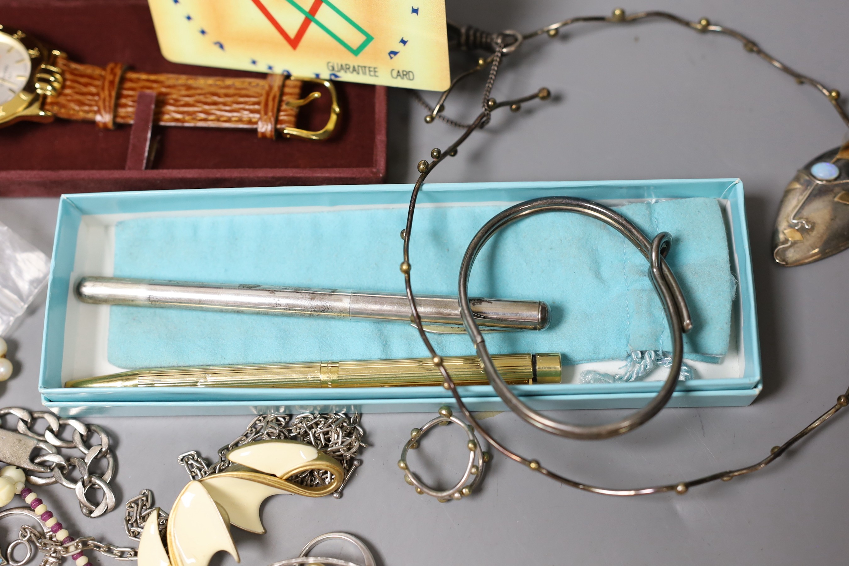 Mixed costume jewellery including filigree bracelet, bangles etc. and other items including two pens and a fob watch.